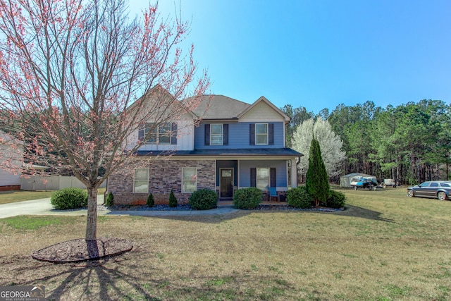 traditional home featuring a front yard and a porch