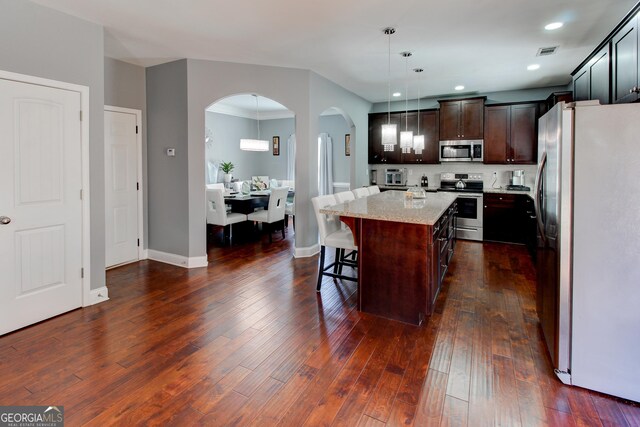 carpeted home office featuring lofted ceiling and visible vents