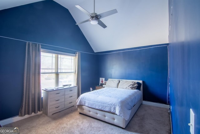 bedroom with high vaulted ceiling, carpet flooring, and a ceiling fan