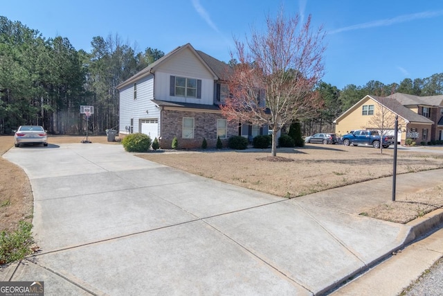 view of front of property with driveway and an attached garage