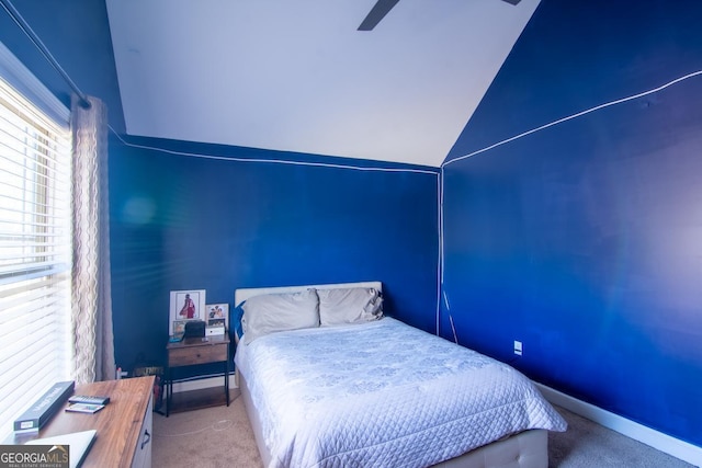 carpeted bedroom featuring vaulted ceiling, ceiling fan, and baseboards