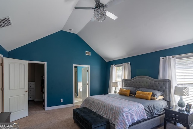 carpeted bedroom featuring vaulted ceiling, ceiling fan, connected bathroom, and visible vents