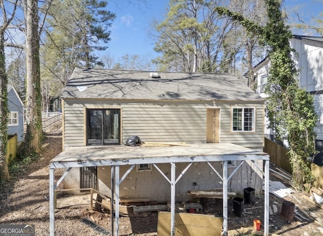 rear view of property with fence