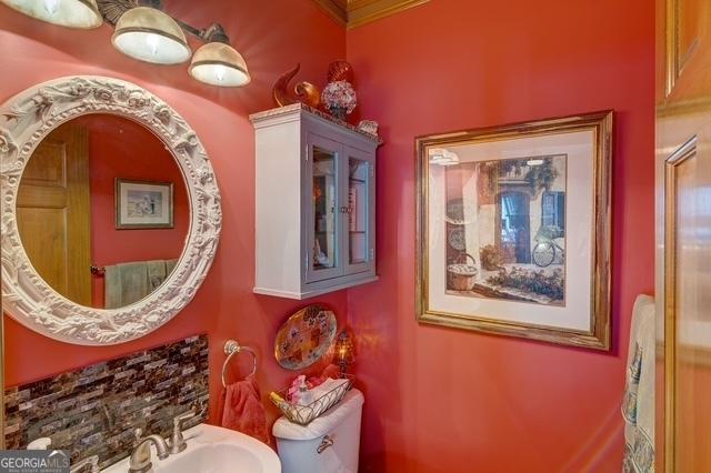 bathroom with a sink and toilet