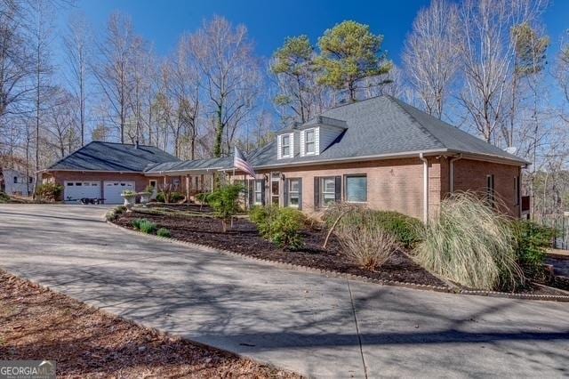 view of front of house featuring brick siding and driveway