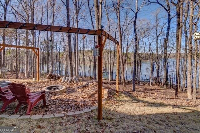 view of yard with a fire pit