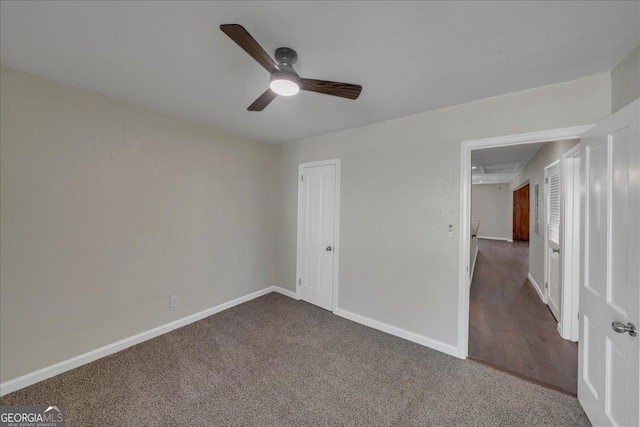 unfurnished bedroom with ceiling fan, a closet, carpet, and baseboards