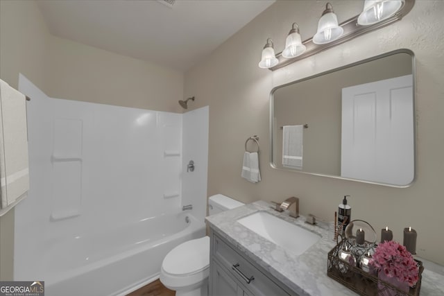 full bathroom with shower / tub combination, vanity, and toilet