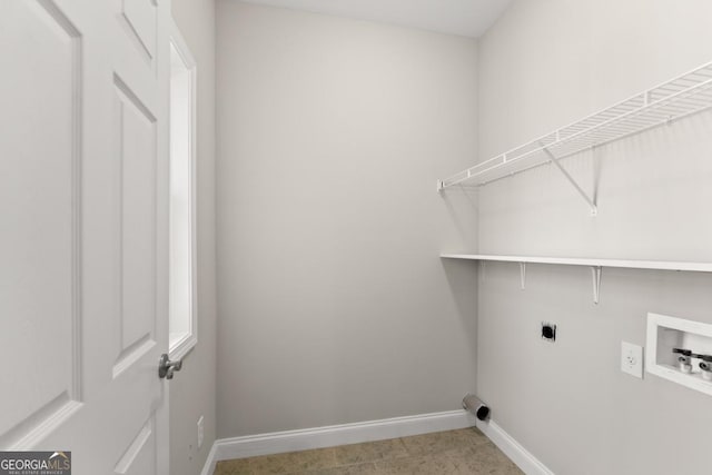 clothes washing area with washer hookup, laundry area, hookup for an electric dryer, and baseboards