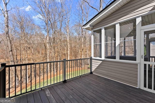 wooden deck featuring a sunroom