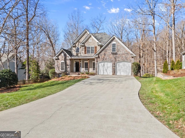 view of front of house with a garage, fence, concrete driveway, and a front yard