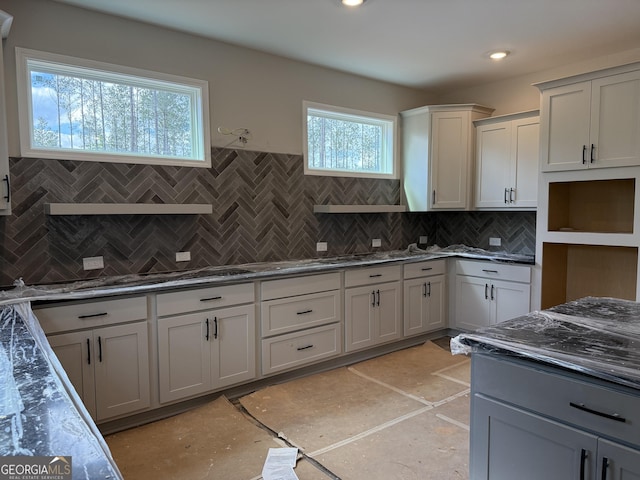 kitchen featuring backsplash and recessed lighting