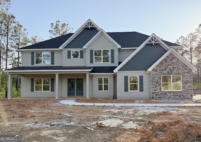 view of front of property with roof with shingles
