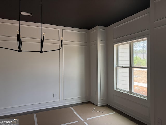 interior space with baseboards and a healthy amount of sunlight
