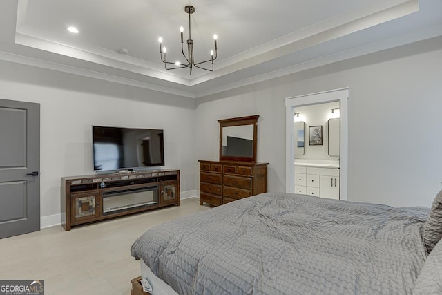 bedroom with an inviting chandelier, a raised ceiling, crown molding, and baseboards