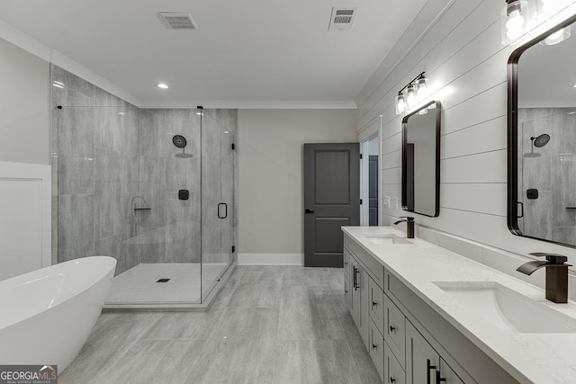 bathroom featuring a stall shower, visible vents, and a sink