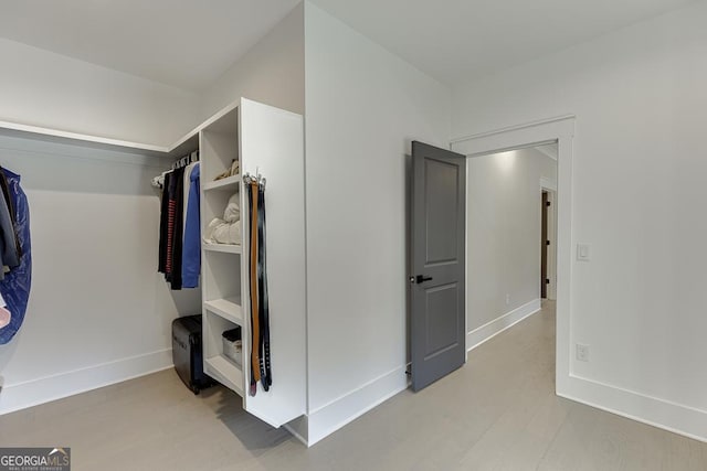 spacious closet with light wood-style floors