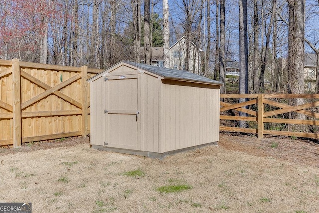 view of shed featuring a fenced backyard