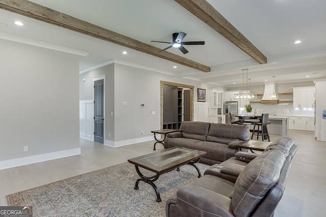 living area with beam ceiling, recessed lighting, crown molding, and a ceiling fan