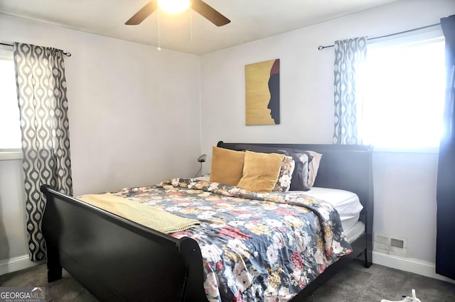 bedroom with carpet floors, baseboards, visible vents, and ceiling fan