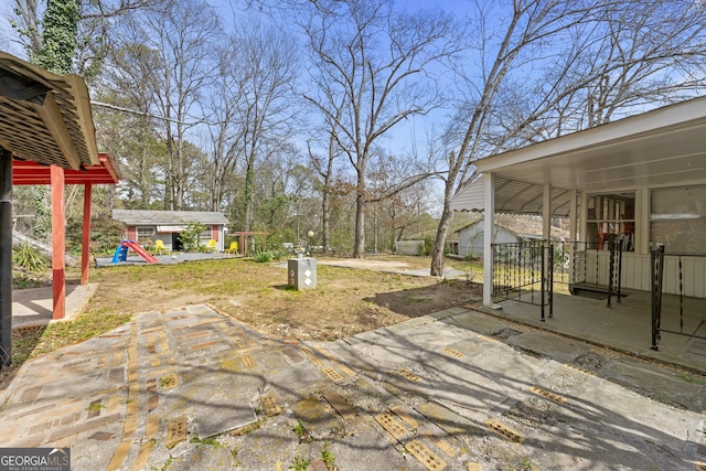 view of patio featuring an outdoor structure