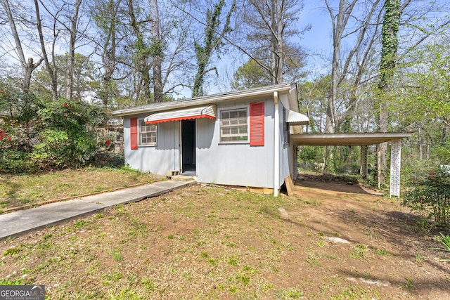 view of outbuilding featuring a carport