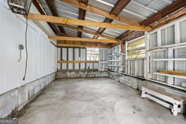interior space with unfinished concrete flooring