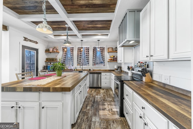 kitchen featuring coffered ceiling, butcher block countertops, dark wood-style flooring, stainless steel appliances, and open shelves