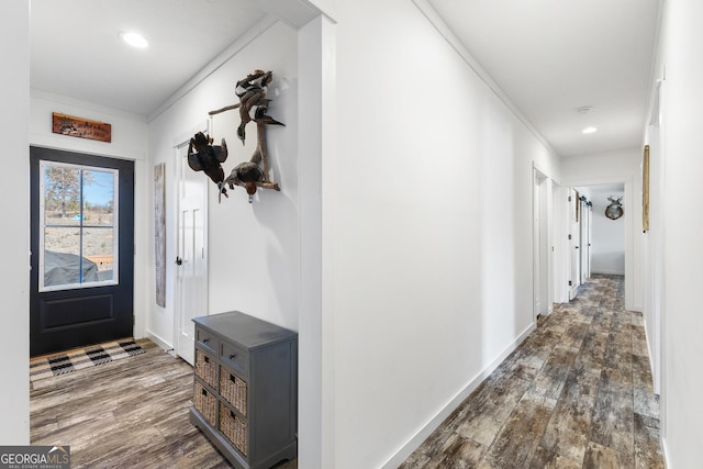 foyer entrance with dark wood-style flooring, recessed lighting, and baseboards