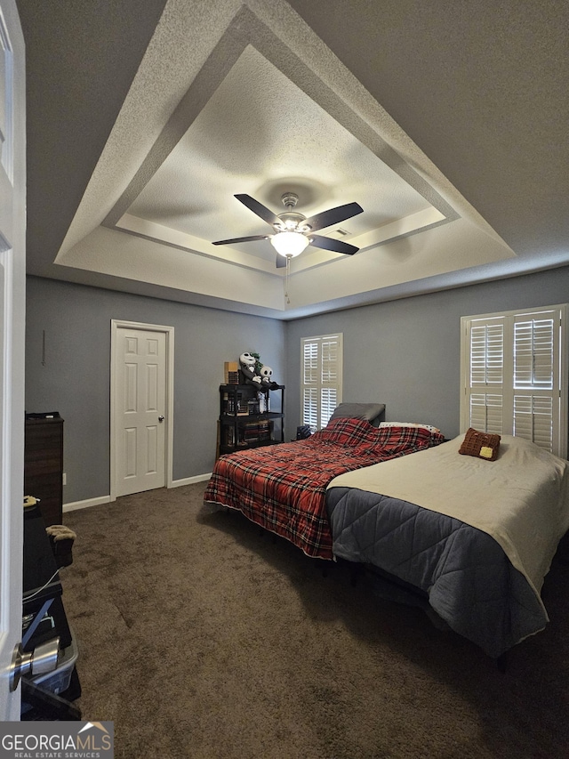 1722 Harrogate Dr, Augusta, GA 30906 - carpeted bedroom featuring ceiling fan, baseboards, a raised ceiling, and a textured ceiling
