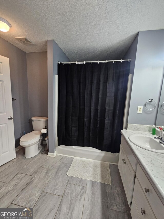 1722 Harrogate Dr, Augusta, GA 30906 - full bathroom featuring visible vents, vanity, toilet, and a shower with curtain