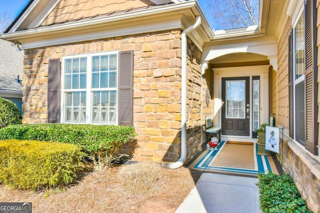 view of exterior entry with stone siding