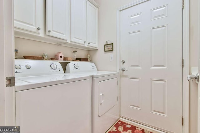 laundry room featuring cabinet space and washing machine and dryer