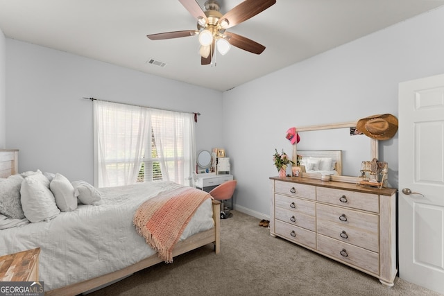 bedroom featuring light carpet, ceiling fan, visible vents, and baseboards