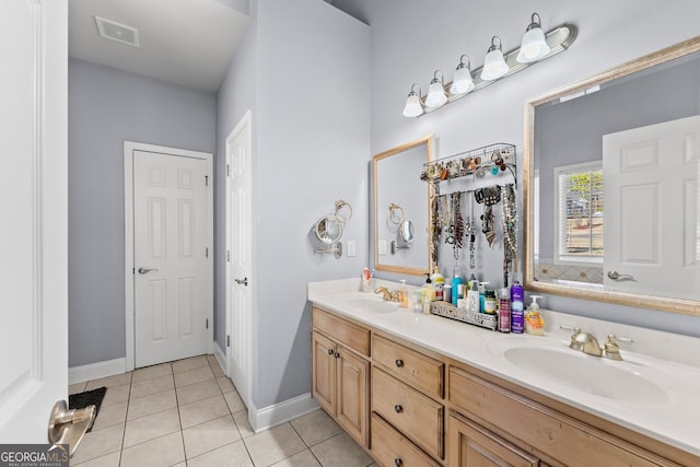 full bath featuring tile patterned flooring, visible vents, a sink, and double vanity