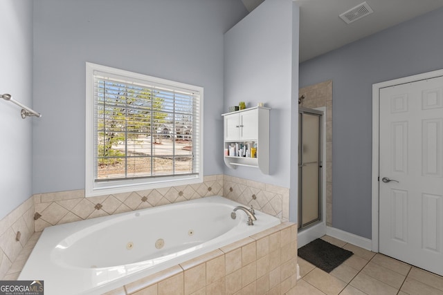 full bathroom featuring a stall shower, tile patterned flooring, visible vents, and a jetted tub