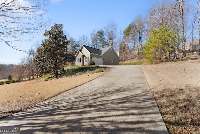 exterior space with a garage and concrete driveway