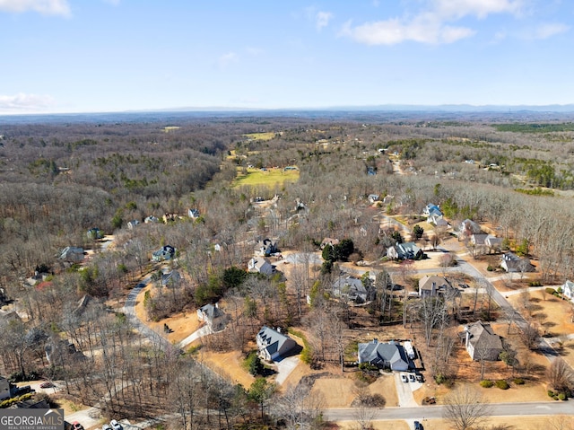 drone / aerial view with a view of trees