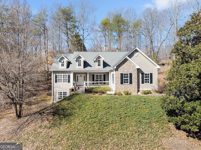 view of front facade featuring stone siding, a porch, and a front yard