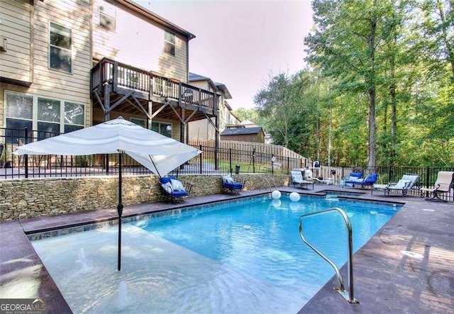 view of pool featuring a patio area, fence, and a fenced in pool