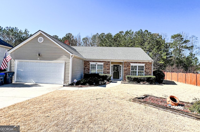 single story home featuring a garage, stone siding, driveway, and fence