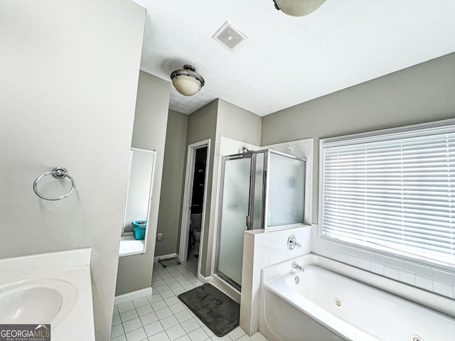 bathroom featuring visible vents, tile patterned flooring, a shower stall, a jetted tub, and toilet