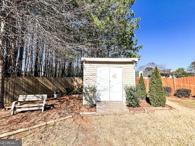 view of shed with fence