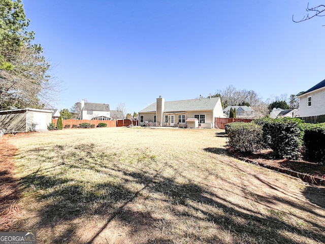 view of yard featuring a fenced backyard