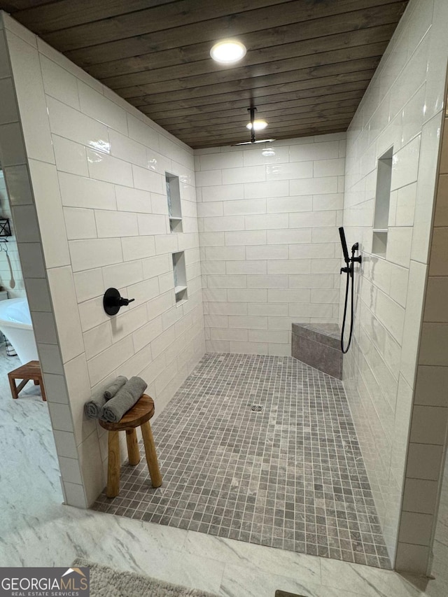 bathroom with wooden ceiling, a tile shower, and recessed lighting