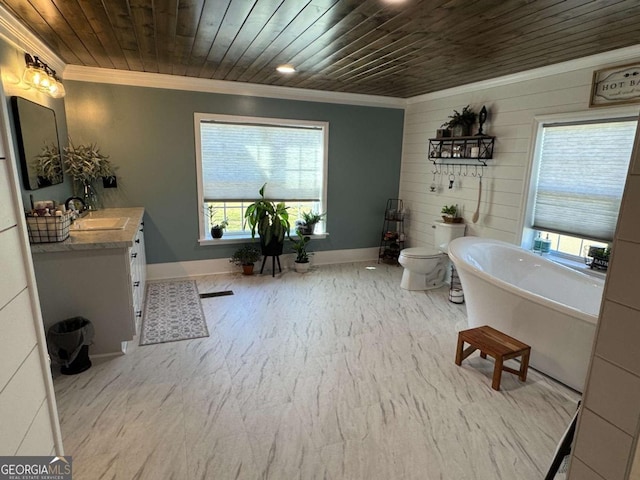 full bathroom with a freestanding tub, wood ceiling, crown molding, and vanity