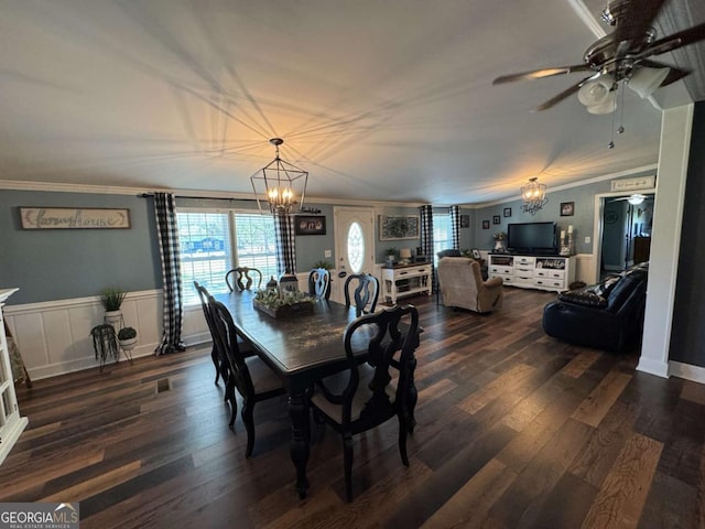 dining space featuring ornamental molding, a wealth of natural light, and dark wood-style flooring