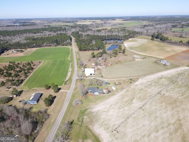 birds eye view of property with a rural view