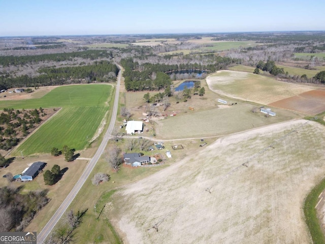 birds eye view of property featuring a rural view