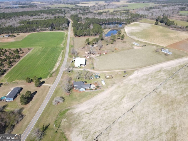 birds eye view of property with a rural view